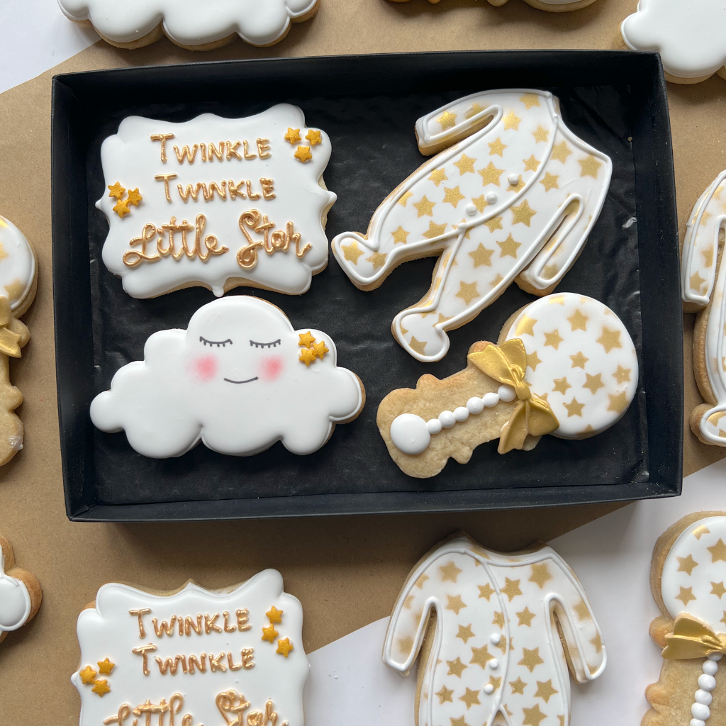 white and gold royal iced biscuits for new parents gift