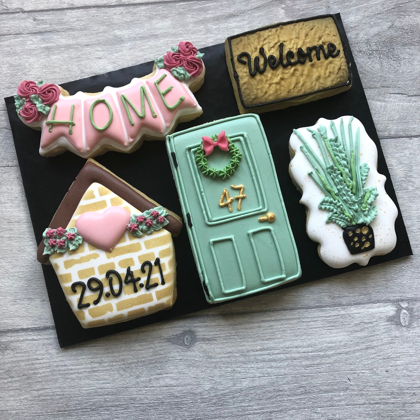 iced biscuits for new home owners including in various shapes and colours