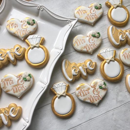 Iced wedding biscuits including heart and ring biscuit shapes