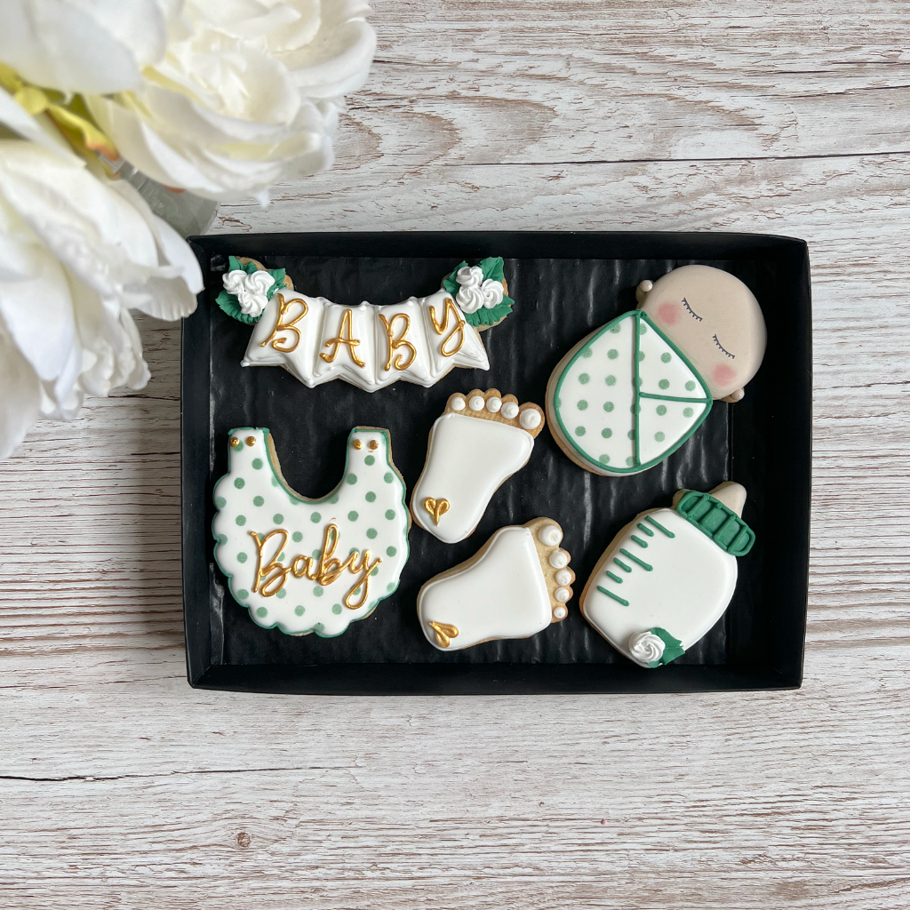 white green and gold royal iced biscuits for a new parents gift 