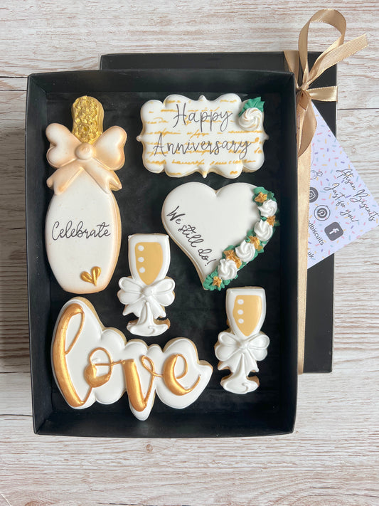 white and gold iced biscuits for anniversary gift